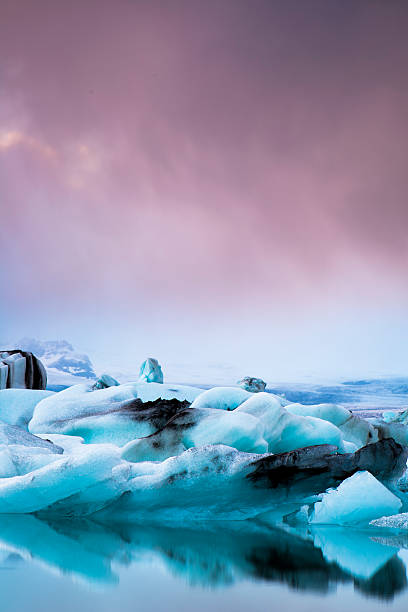 istock blue Iceburgs and pink sky 464085597