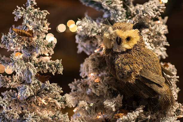 istock snowy trees with wooden owl and straw 464085987