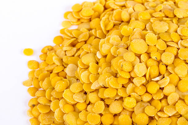 istock Yellow lentils isolated on white background.Macro shot 464091519
