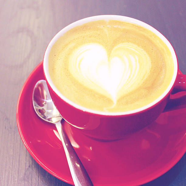istock Cappuccino or latte coffee with heart shape, retro filter effect 464092079