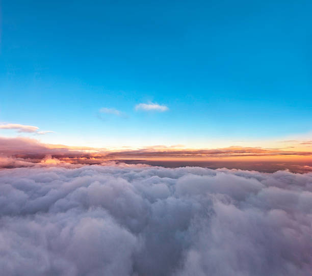 istock Velvet sunset above cloudscape from airplane 464092503