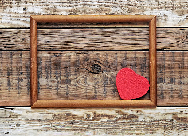istock red heart in an old wooden frame 464096379