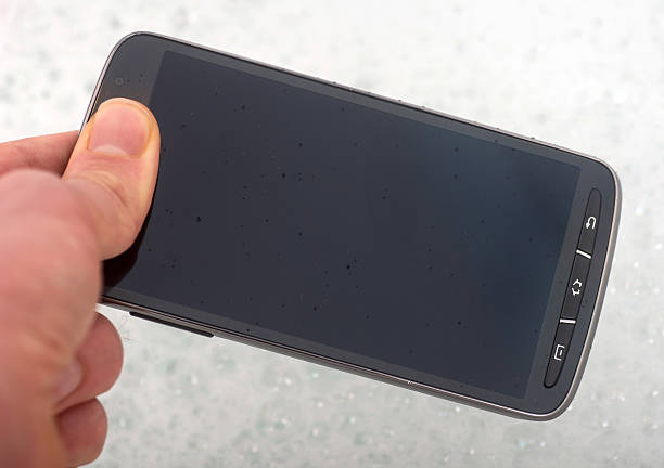 istock smartphone in hand on bathtub - on the bathtub 464106929