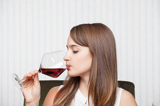 istock Beautiful girl drinking wine 464148763