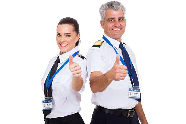istock airline pilots giving thumbs up 464149375