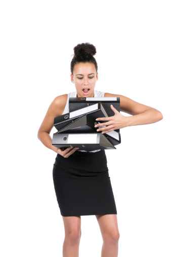 Cut out image of a young beautiful business woman who can't hold a stack of files any longer