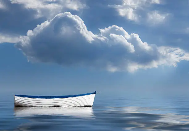 Photo of Old rowing boat marooned at sea