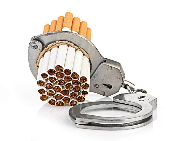 istock Addition concept with cigarettes and handcuffs 464193769