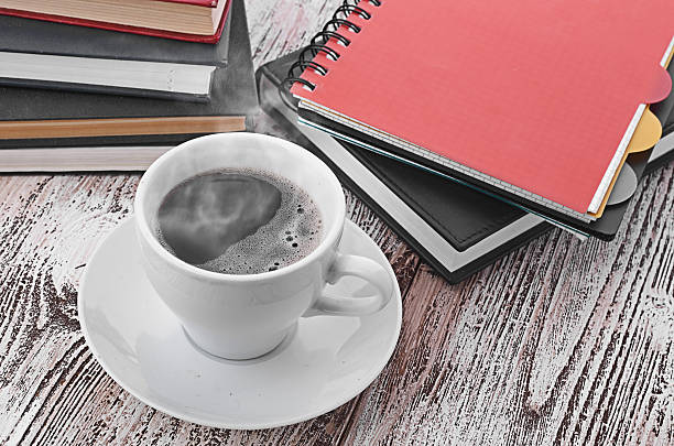 istock Cup of coffee on a wooden table 464194519