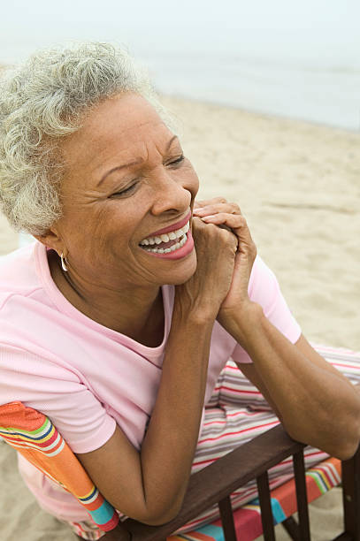 istock Woman Smiling at Beach 464198869