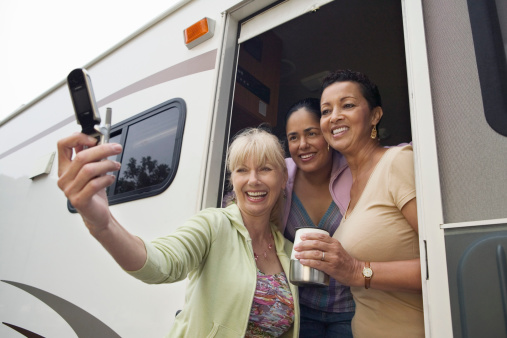 Ladies in RV Using Camera Phone