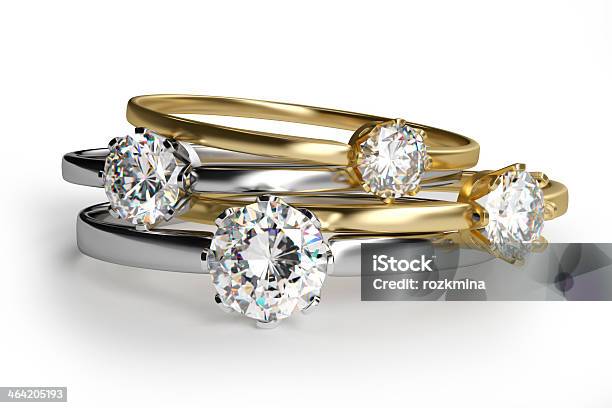 Closeup Of Assorted Diamond Rings In White Background Stock Photo - Download Image Now