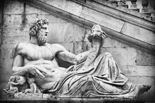 Tiber Statue. The great sculpture is located at the bottom side of the staircase of the Capitol Square, projected by Michelangelo. Black and White. Slight vignette added.