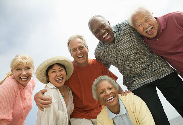 Group of Friends Laughing Group of Friends Laughing 50 59 years stock pictures, royalty-free photos & images