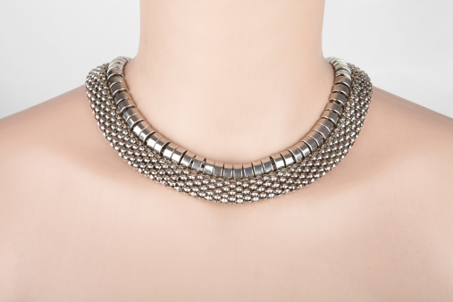 Beautiful silver statement necklace on a mannequin