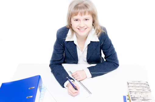 Woman doctor working at her desk on white background