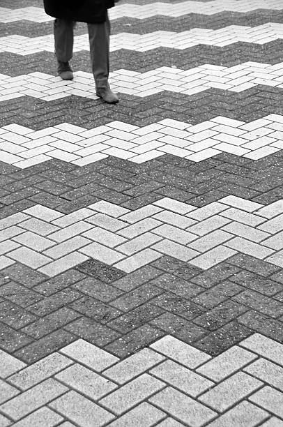 istock Legs of man walking on zebra crossing 464225455
