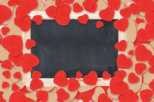 istock blank chalkboard over Valentine hearts background 464228355