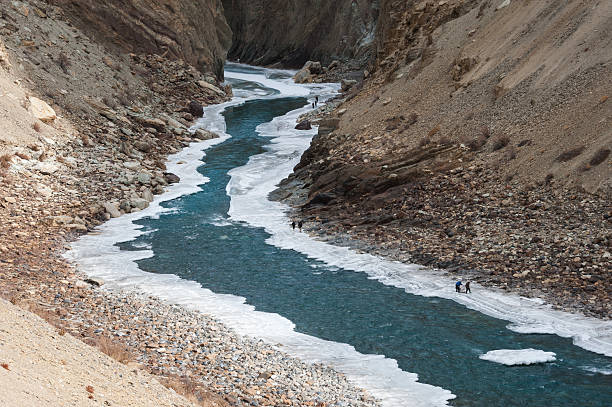 Winter trekking on the frozen Zanskar River in Ladakh.The Chadar trek is one such route, connecting villages in the Zanskar valley (deep in the mountains) with Chilling (on the road to Leh) along the frozen Zanskar River.