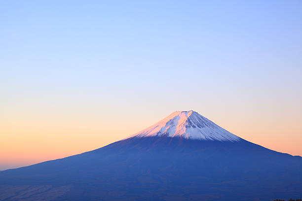 Picture of snow capped Mt Fuji at daybreak Daybreak at the Mt. Fuji, Yamanashi, Japan mt. fuji photos stock pictures, royalty-free photos & images