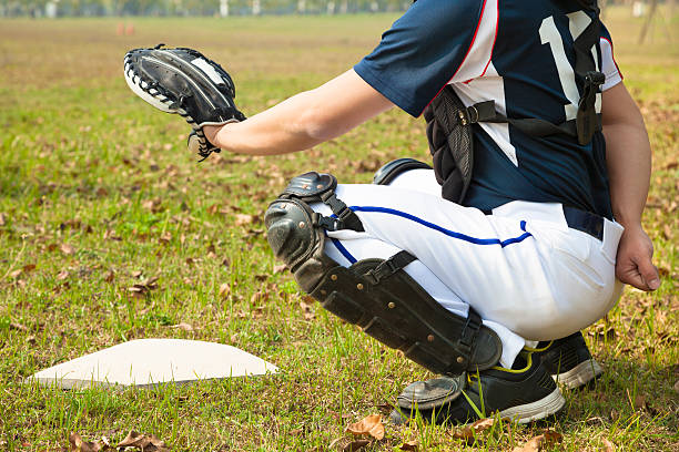 istock baseball catcher ready to catch ball at  home plate 464266565