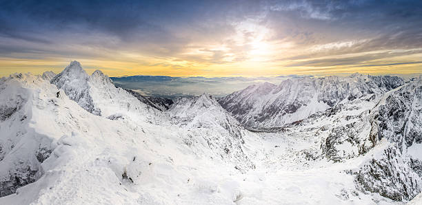 istock Panoramic view of winter mountains at sunset 464270655