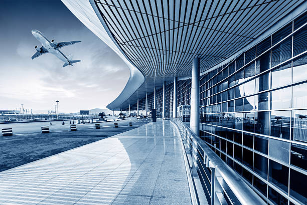 istock Airport terminal with plane taking off  464280587
