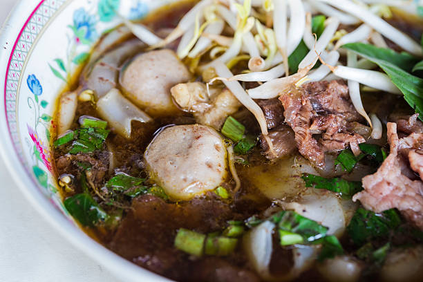 istock Wide rice noodle in thick soup with beef 464290293