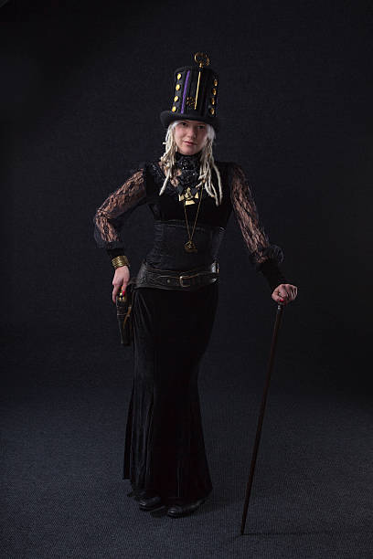 Steampunk Gunfighter Formal portrait of a blonde Steampunk girl shootist with dreadlocks. steampunk pistol pictures stock pictures, royalty-free photos & images