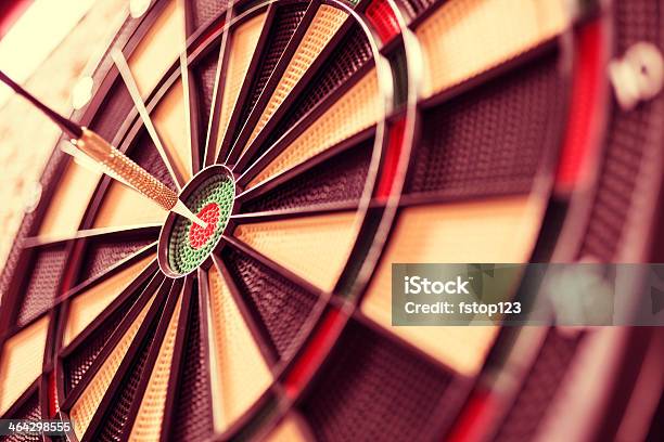 Sports Bulls Eye Dart Directly In Center Of Dartboard Accuracy Stock Photo - Download Image Now