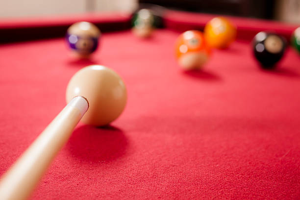 istock Sports: Personal perspective of player hitting pool cue ball. Billiards. 464298843