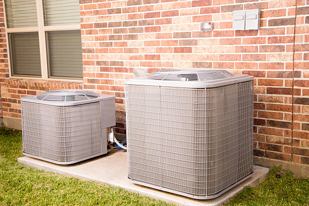 istock Service Industry: Two air conditioner units outside home. 464308729