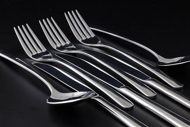 istock Forks,spoons and knifes on a black table 464312207