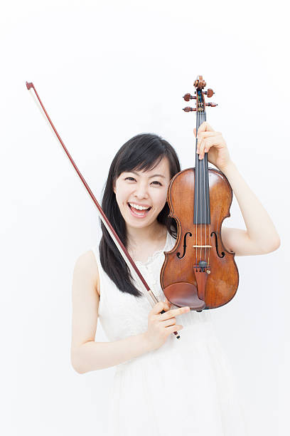 istock girl with violin 464316275