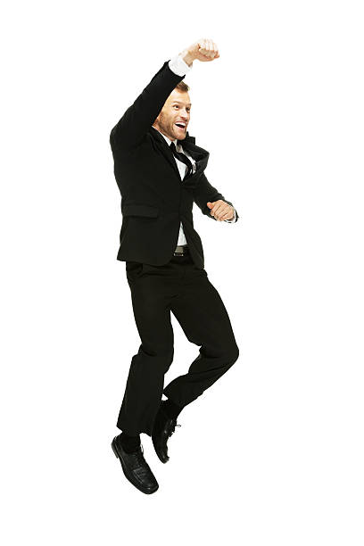 istock Cheerful businessman jumping and cheering 464319067