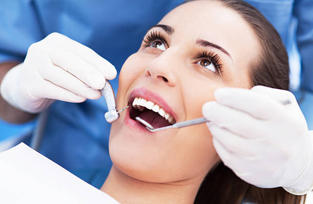 istock Woman having teeth examined at dentists 464323669