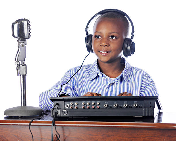 istock Young Boy Manning the Soundboard 464323865