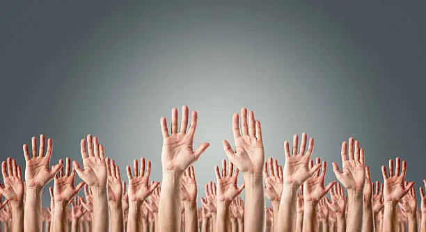 Photo of Hands raised in the air