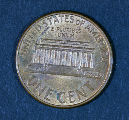 United states of america coin worth 1 cent. Isolated on black.