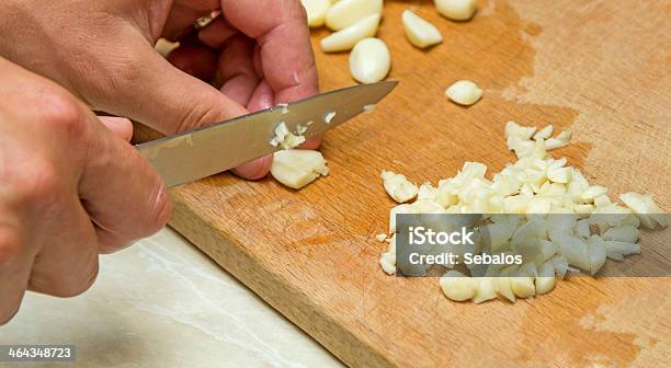 Man Chopping The Garlic Stock Photo - Download Image Now - Chopping Food, Close-up, Clove - Spice