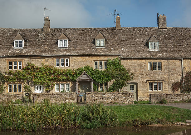 istock Stone houses in Lower Slaughter, Cotswolds, England 464357113