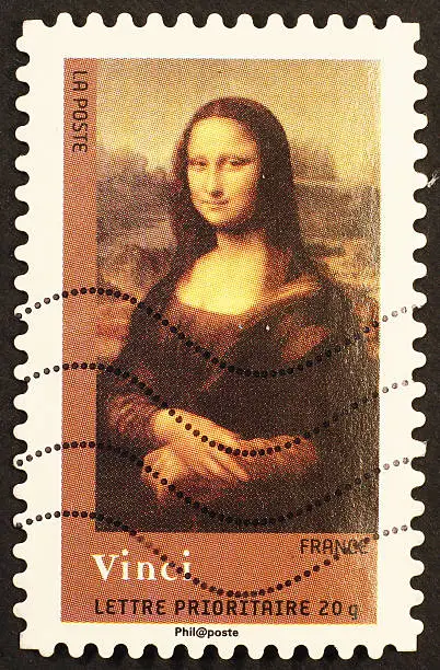French stamp reproducing Mona Lisa, the masterpiece painted by Leonardo da Vinci that is hosted by Louvre Museum of Paris