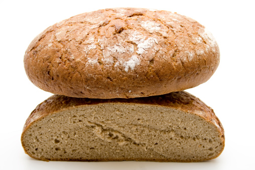 Wheat bread halves on white background