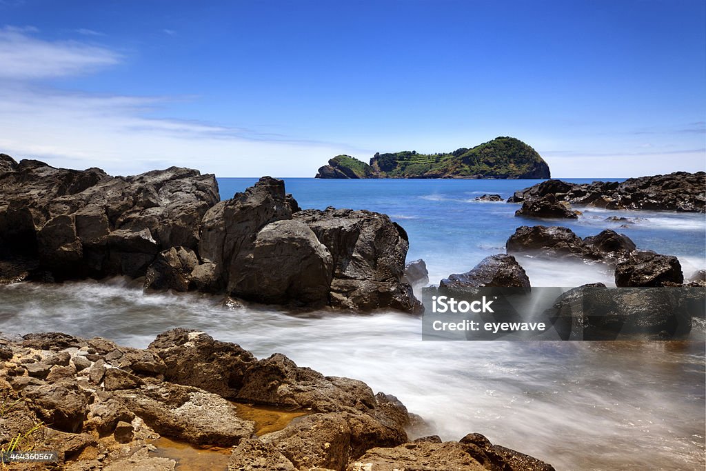 Rocky coast and islet of Vila Franca, Sao Miguel, Azores Long exposure image of rocky coast and the islet of Vila Franca do Campo on Sao Miguel island, Azores Archipelago Stock Photo