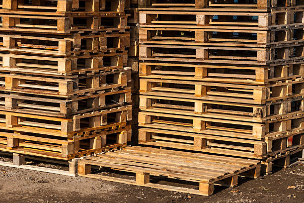istock Wooden transport pallets in stacks. 464363671