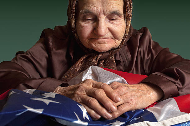 istock Elderly woman with American flag 464364297