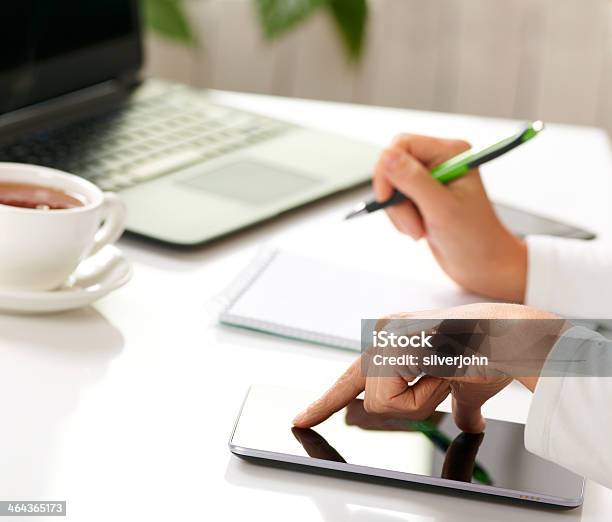 Woman Hands With Tablet Pc And Notepad At Office Stock Photo - Download Image Now - Adult, Beautiful People, Beauty