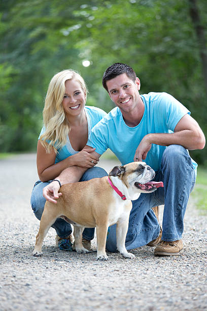 istock couple with dogs 464365291