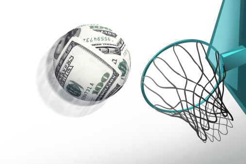 money sphere shoot in basketball hoop,make score,business concept