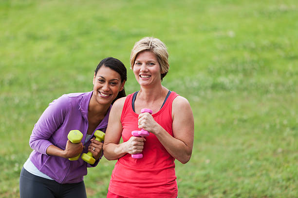 istock Women exercising in park 464378279